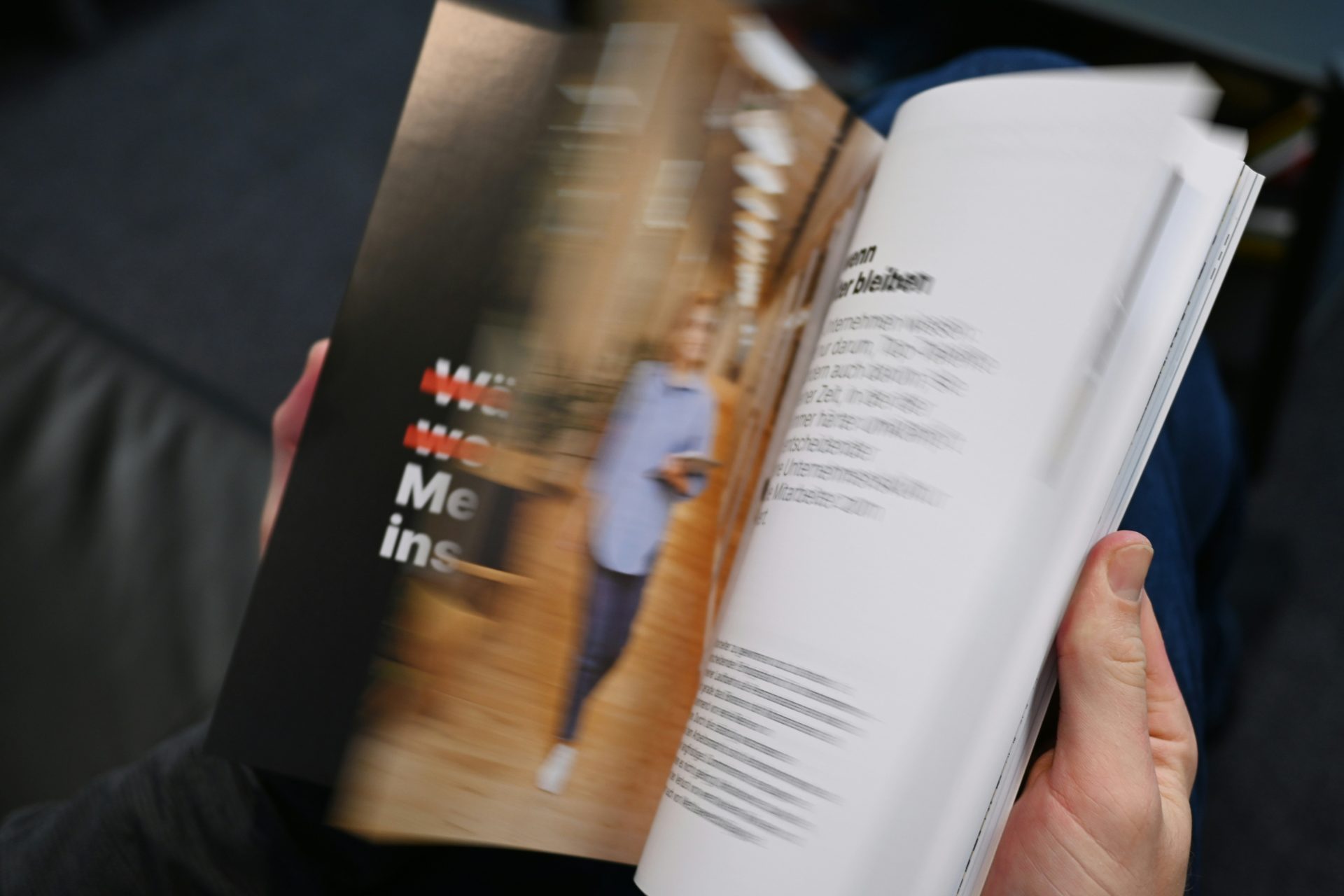 a person holding a book in their hands